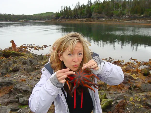 woman posing with starfish